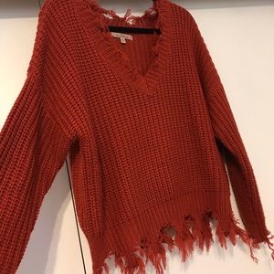 Distressed rust color sweater